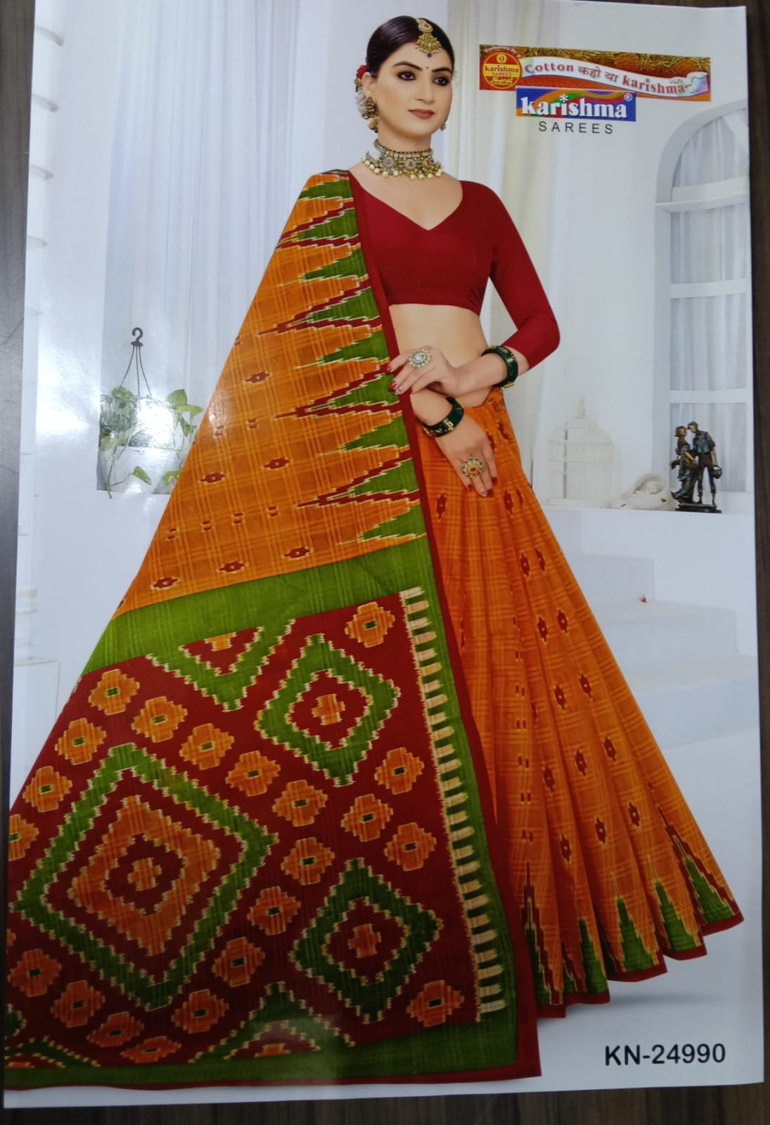Experience the lightweight grace of our Konark Kota pure cotton mulmul (Stiff) saree, featuring traditional geometric prints in warm festive tones.